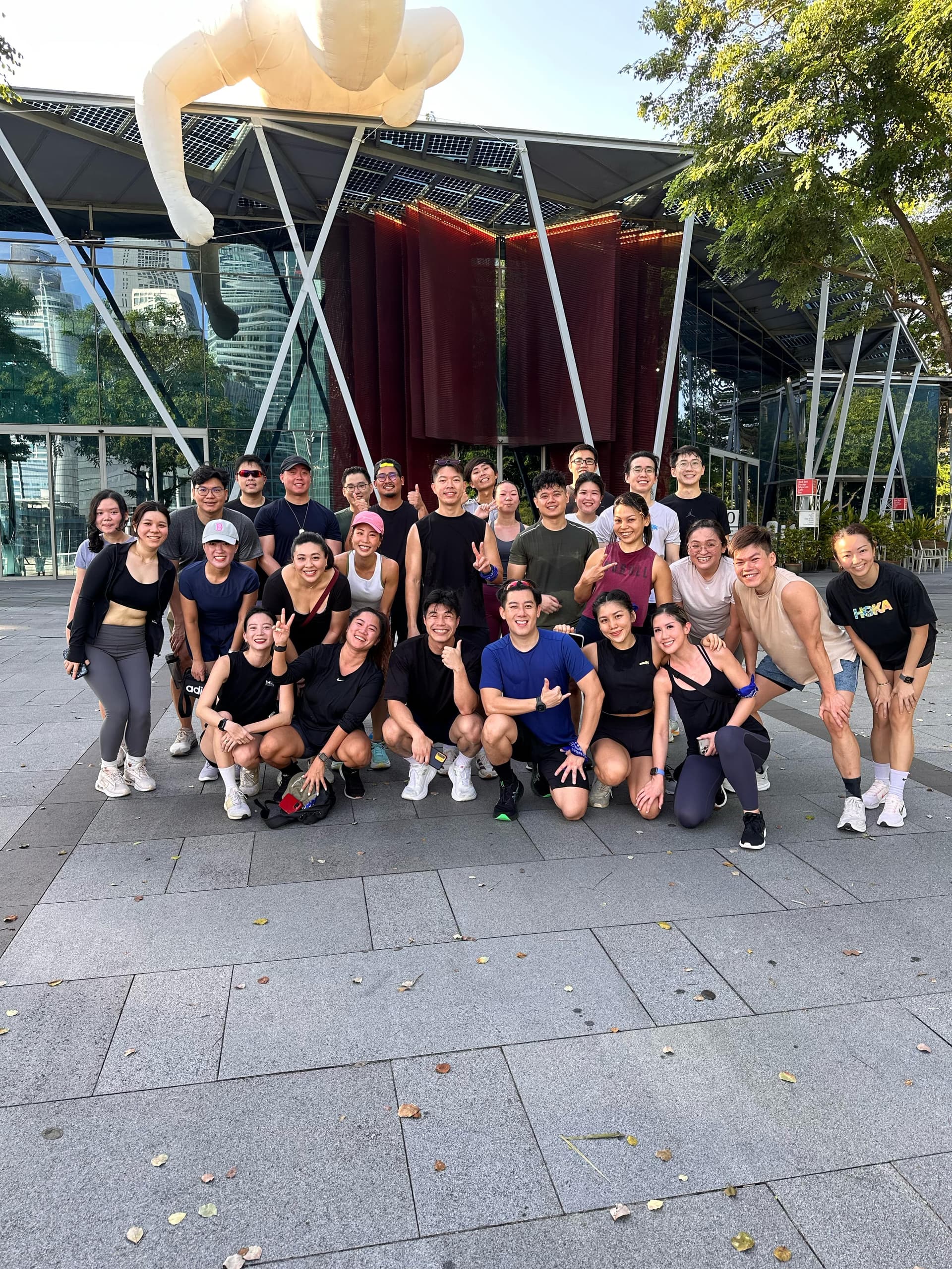 A fitness community smiling together after a session